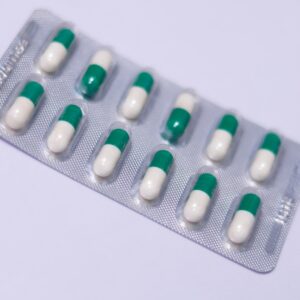 a pack of pills sitting on top of a white table