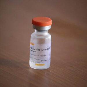 white and red plastic bottle