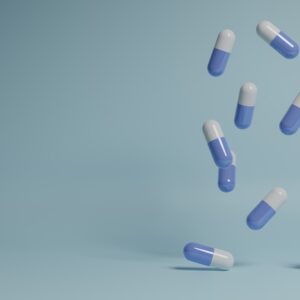 a group of pills falling into the air