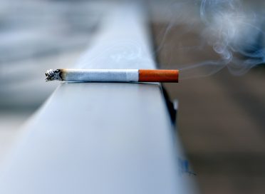 white cigarette stick on white wall