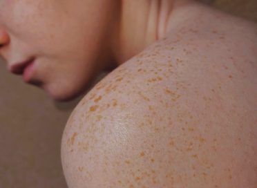 topless woman with brown hair